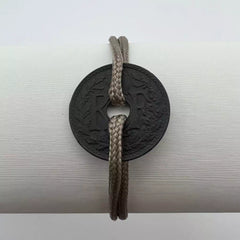 bracelet one piece monnaie trouée de 10 centimes de franc cordon beige le sou francais