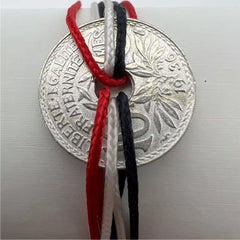 bracelet one piece monnaie trouée de 10 centimes de franc  cordon bleu blanc rouge aux couleurs de la France le sou francais
